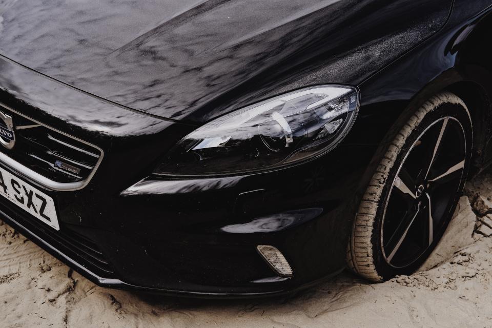 A clean black sedan with straight, dent-free panels